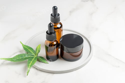 Preview: Cannabis face cream and serum or oil dropper concept. Natural cosmetic. CBD oil, THC tincture