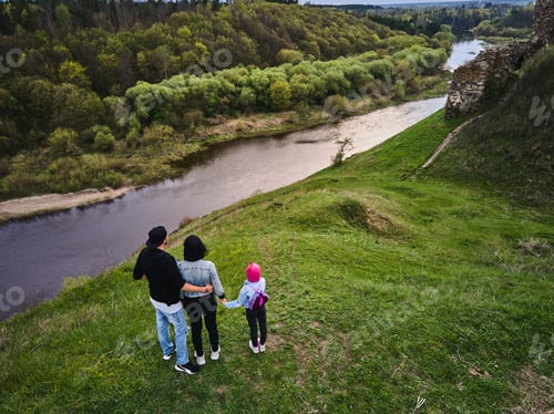 Preview: Mother, father daughter enjoys the view on the coast Sluch river