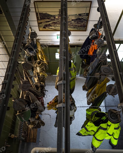 Preview: Vertical shot of gloves in old mining company