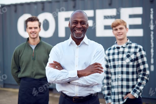 Preview: Portrait Of Male Multi-Cultural Freight Haulage Team Standing By Shipping Container