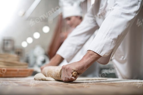 Preview: Baker rolling out dough