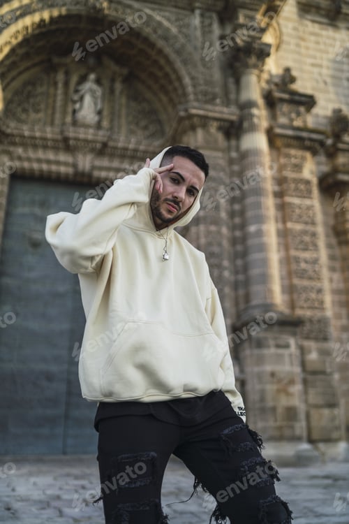 Preview: Vertical shot of a handsome male posing in front of the camera