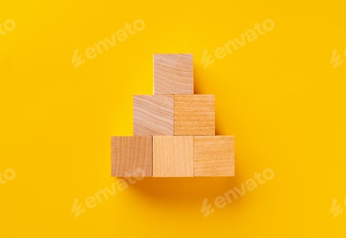 Preview: Top view of wooden cubes on yellow