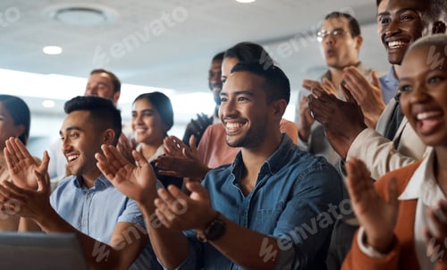 Preview: Shot of a group of young businesspeople clapping during a conference in a modern office