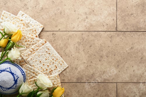 Preview: Passover celebration concept. Matzah, kosher red wine, walnut and white and yellow roses. Traditiona