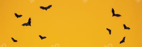 Preview: Concept of Halloween, paper bats on yellow background