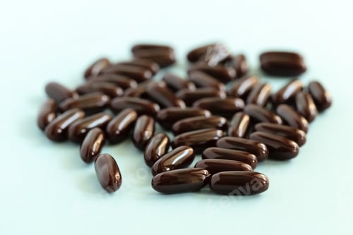 Preview: Medical pills and capsules. Brown medication on blue background. Pharmacy, healthcare, health