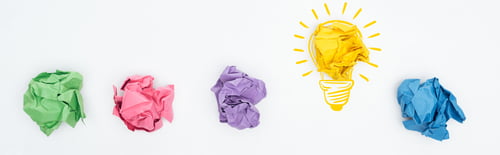 Preview: panoramic shot of multicolored crumpled paper balls and light bulb illustration on white background,