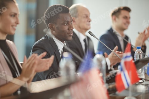 Preview: African man clapping at conference