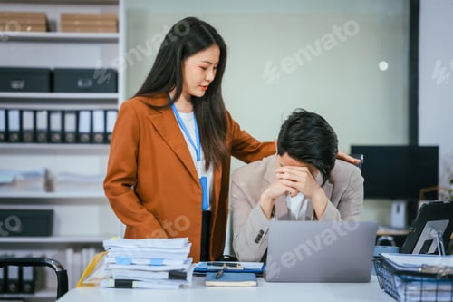 Preview: Male and female businessmen are working stressed at the office, focused on their tasks,managing
