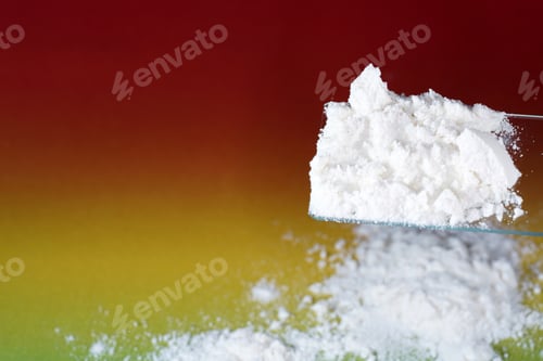 Preview: Closeup shot of white flour looking like drug on a colorful background