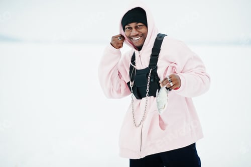 Preview: Stylish urban style african american man in pink hoodie