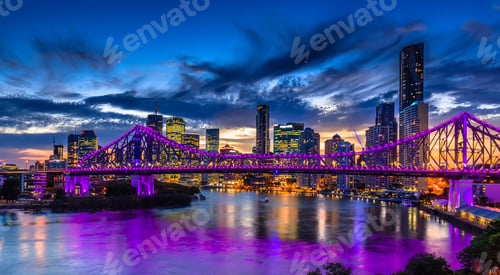 Preview: Vibrant night time panorama of Brisbane city with purple lights