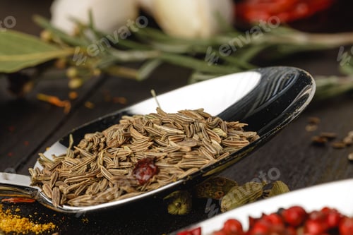 Preview: Spoon with spices on dark wooden table close up