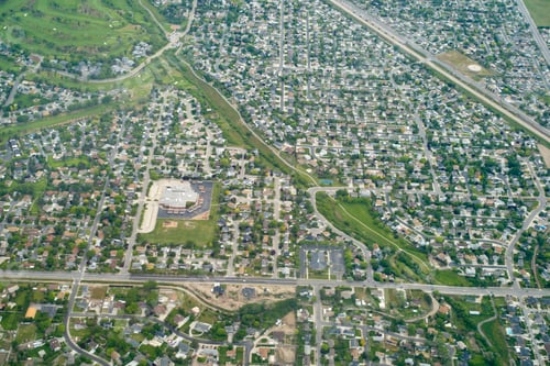 Preview: Aerial view of a sprawling suburban neighborhood with roads, houses, and green areas. Oregon, USA