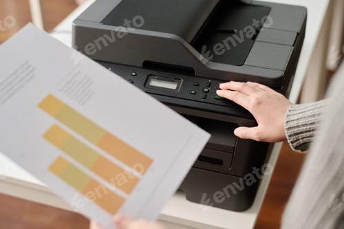 Preview: Unrecognizable Woman Printing Documents In Office