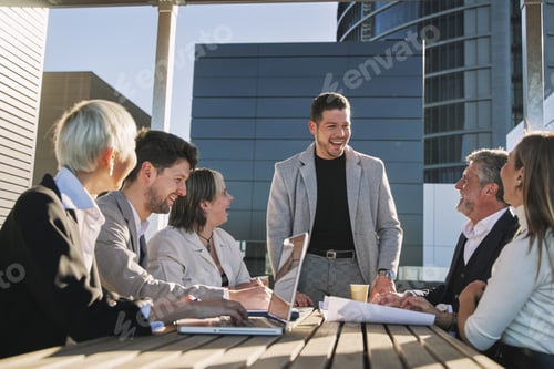 Preview: Office colleagues having casual discussion during meeting in conference room.