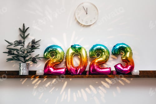Preview: Christmas tree, white clock and decorations in front of wooden wall