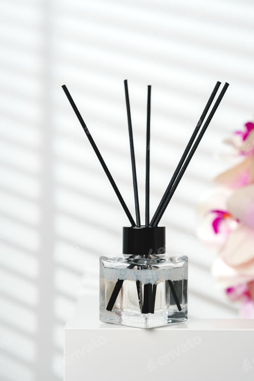 Preview: Elegant Reed Diffusers Beside Blooming Orchids in a Bright Interior Setting