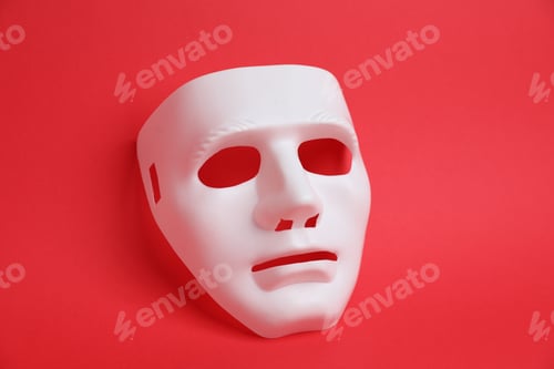 Preview: One white theatre mask on red background, above view