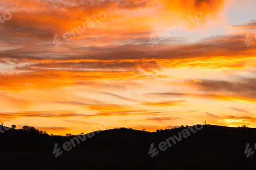 Preview: Stunning sunset over a silhouette of hills in Sunset Flinders Ranger National Park