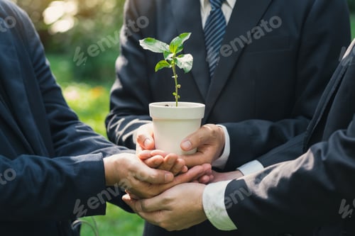 Preview: Earth Day Environmental, Business hands holding a plant pot with green