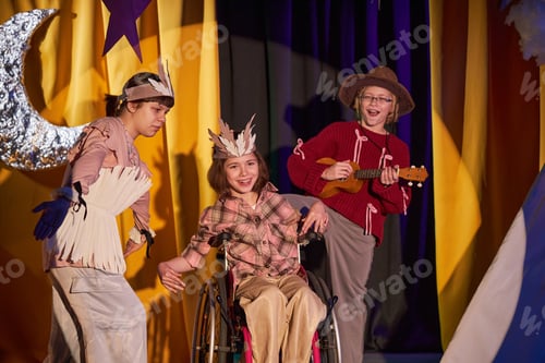 Preview: Happy Girl in Wheelchair Singing Song with Friends on Stage at Childrens Theater