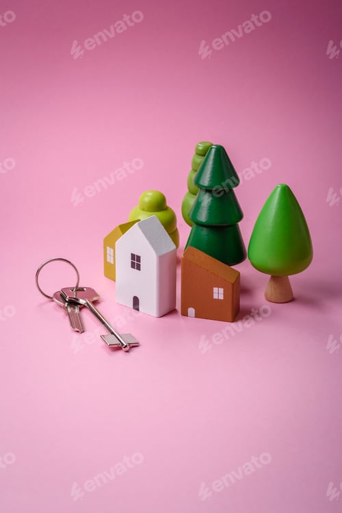 Preview: A small wooden house and keys as an idea for investing in your own home