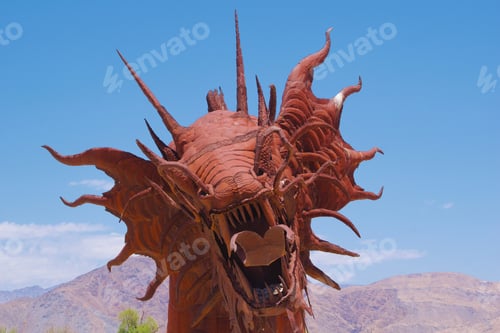 Preview: 350' steel serpent weaving in & out of the desert floor welded together by artist Ricardo Breceda