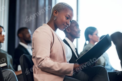 Preview: Shot of a group of businesspeople taking notes during a meeting in an office