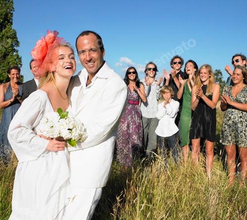 Preview: Married couple, group of people behind