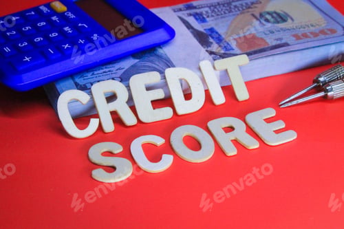 Preview: calculator and paper money with the word credit score. Earning concept
