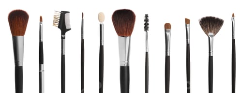 Preview: Set with different makeup brushes for applying cosmetic products on white background. Banner design