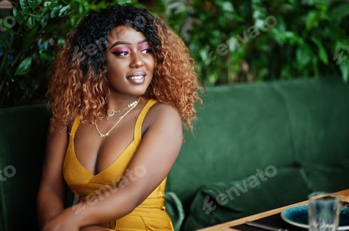 Preview: African american woman in yellow dress