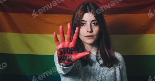 Preview: Sad and disappointed girl raises her hand with written no war in front