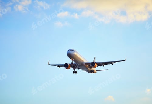 Preview: Flying airplain over blue sky