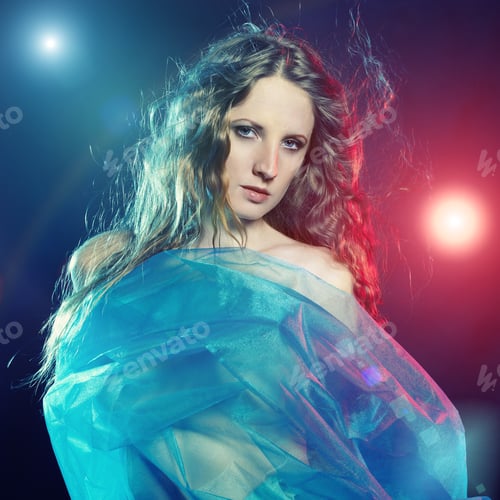 Preview: Portrait of the young dancing woman against color flashes