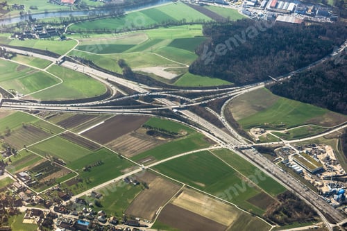 Preview: Aerial shot of a large road intersection and a highway in the countryside