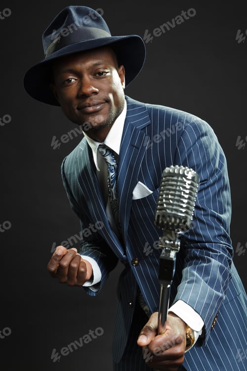 Preview: Black Man With Blue Striped Suit And Blue Hat Singing.