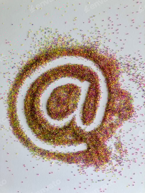 Preview: At sign used in social media made with colorful textured sparkly sprinkles