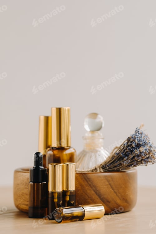Preview: Essential oil in bottles with lavender fragrance, lying on a wooden surface