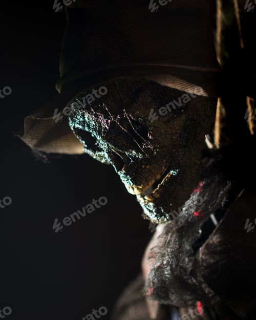 Preview: Vertical stock photo of a skeleton figurine wearing a black top hat and a bow tie