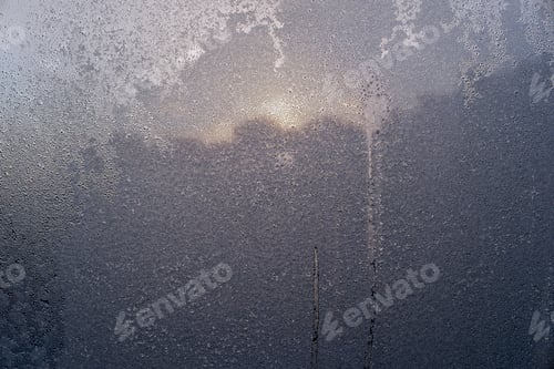 Preview: Abstract Texture Various Patterns Of The Frozen Water On A Glass Surface Against A Sunlight For A