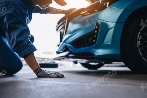 Preview: Maintenance worker checking tire service via insurance system at garage