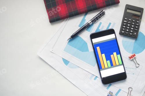 Preview: top view of financial chart display on smart phone on table