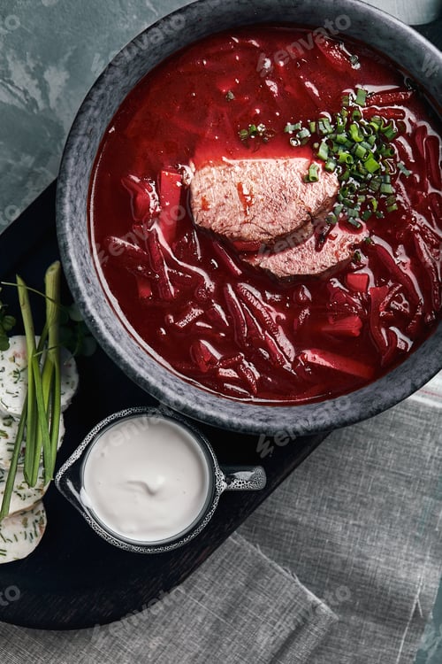 Preview: Ukrainian and Russian traditional beetroot soup - borscht in bowl with rib eye meat, rye bread