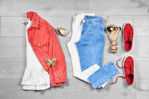 Preview: Set of trendy female clothes and accessories on wooden background, flat lay