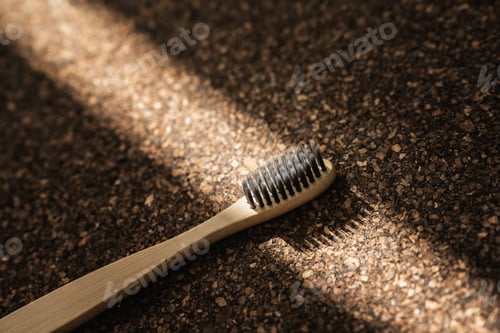 Preview: Close-up of Bamboo Toothbrush on Cork Surface