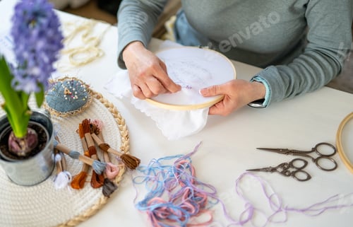 Preview: Girl Embroidering On Fabric Stretched In Hoop