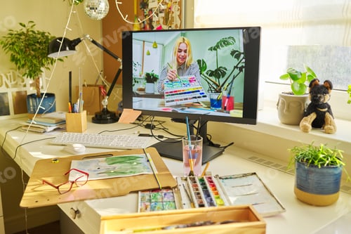 Preview: Teenage girl on computer screen teaches to draw